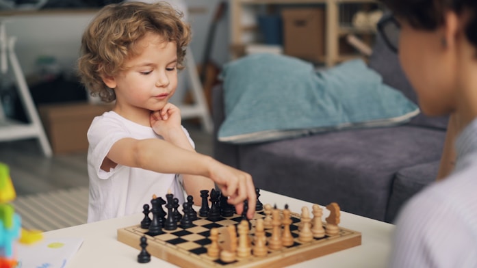 A boy playing chess with a psychologist