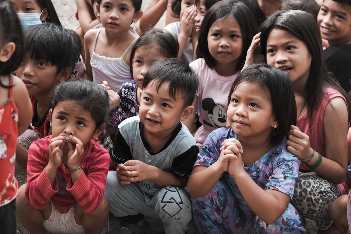 A group of children sitting closely together