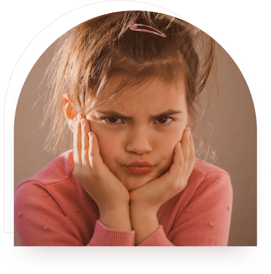 A girl looking upset with her hands on her cheeks